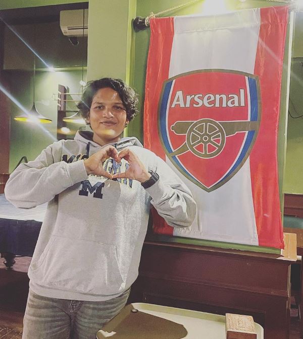 Asha Shobana with Arsenal's flag