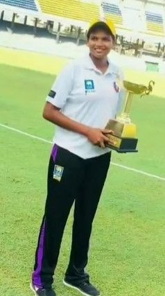 Asha Shobana with the Player of the Tournament trophy