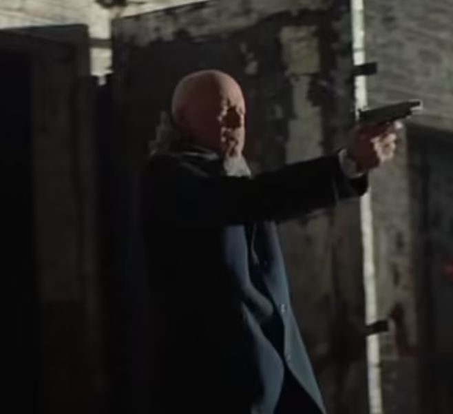 Bruce Willis holding a gun