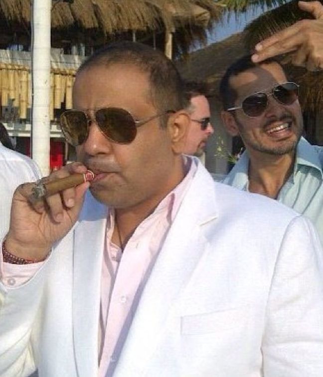 Chikki Panday smoking a cigar