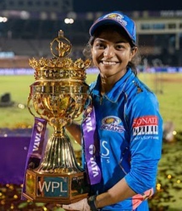 Dhara Gujjar with the Women’s Premier League Cup
