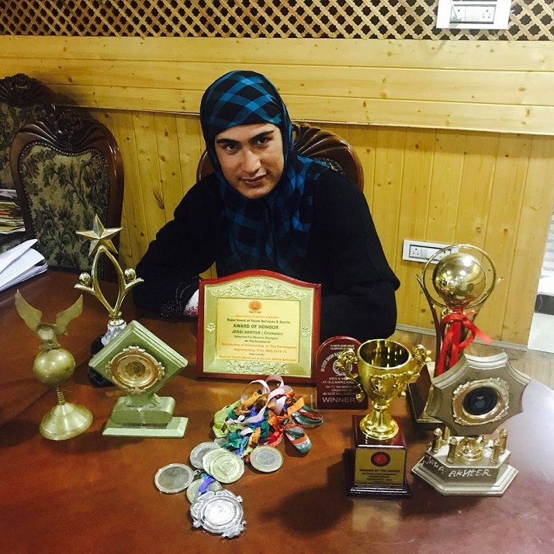 Jasia Akhtar posing with her awards