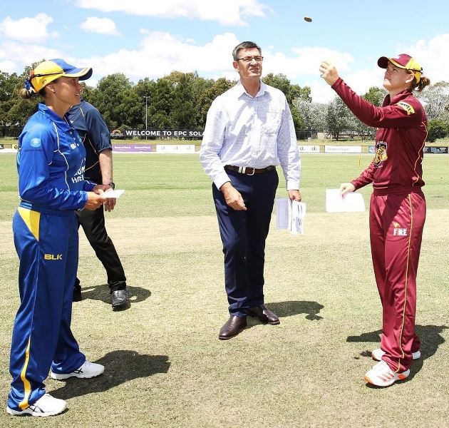 Jess Jonassen tossing of a coin on her first match as the captain of the Queensland Fire