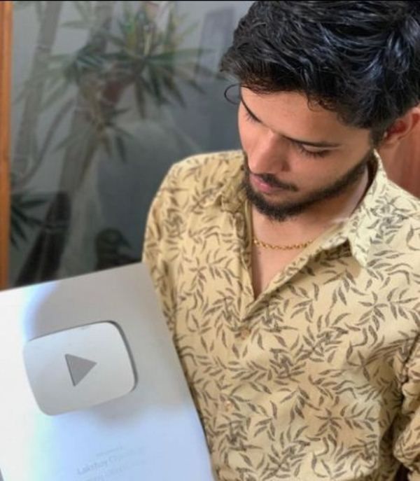 Lakshay Chaudhary with his Silver YouTube Play Button