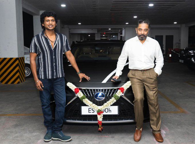 Lokesh Kanagaraj posing with his brand new Lexus car, which was gifted to him by the Indian actor Kamal Haasan