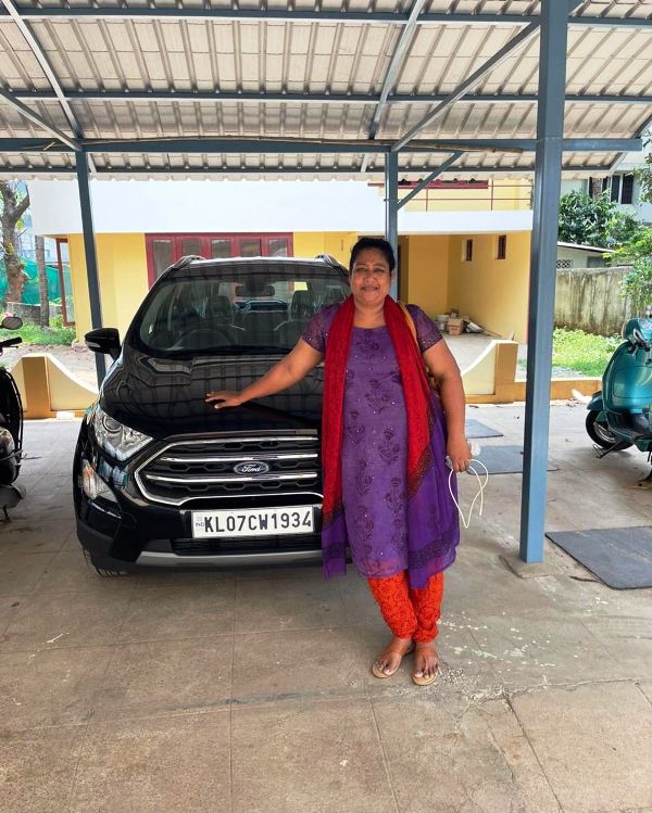 Maneesha standing in front of her Ford EcoSport