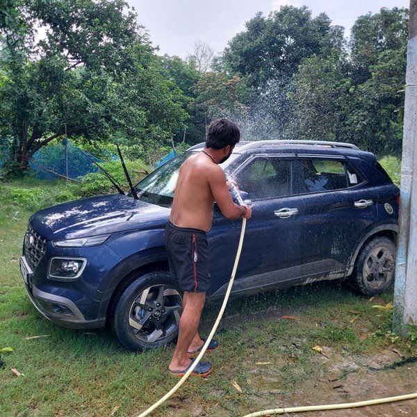 Manish Kashyap washing his Hyundai Venue SUV