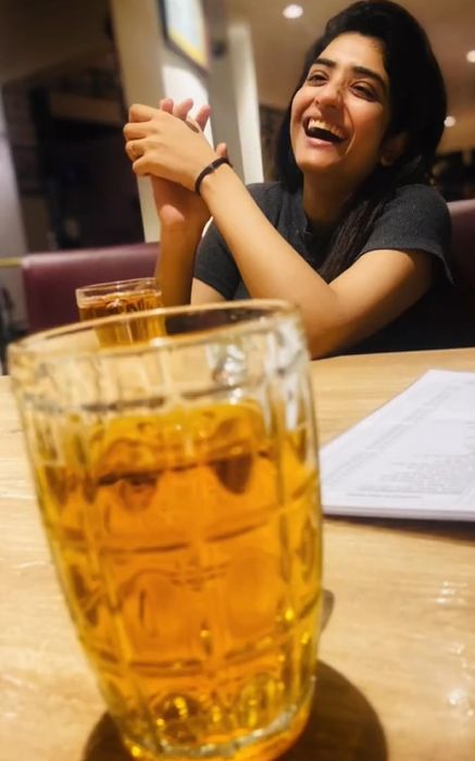 Manosi Sengupta with a glass of beer