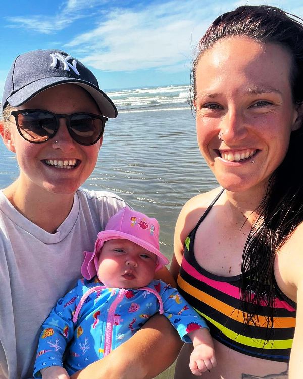 Megan Schutt and Jess Holyoake with their daughter, Rylee