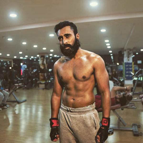 Rinosh George during a workout in a gym