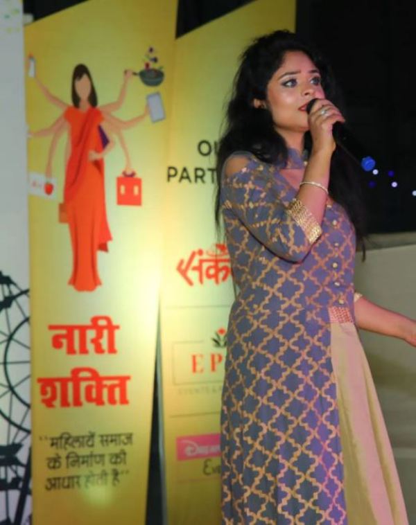 Ritika Gupta while singing at an event