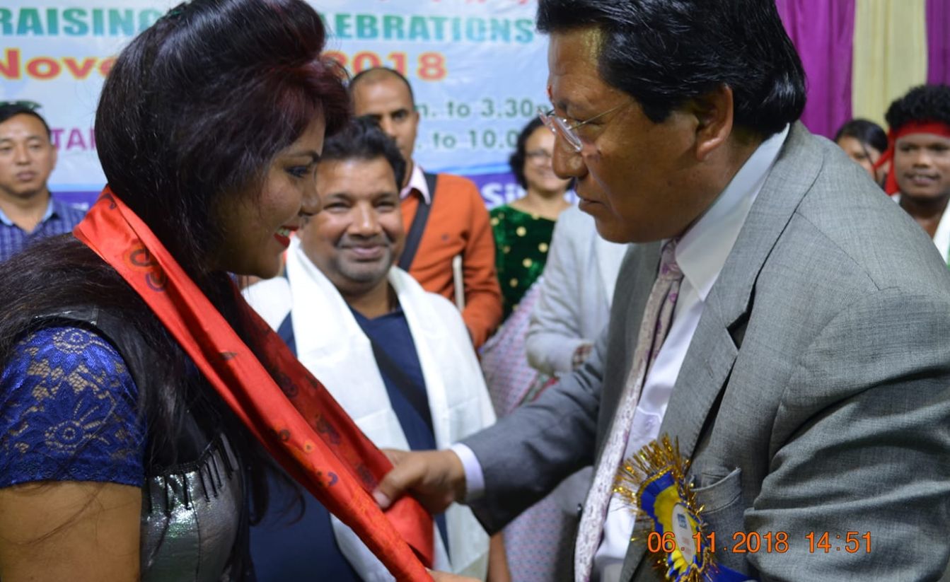 Ruchismita Guru getting an honor from the minister of Sikkim