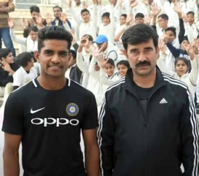 Shivam Mavi (left) with his coach, Phoolchand Sharma