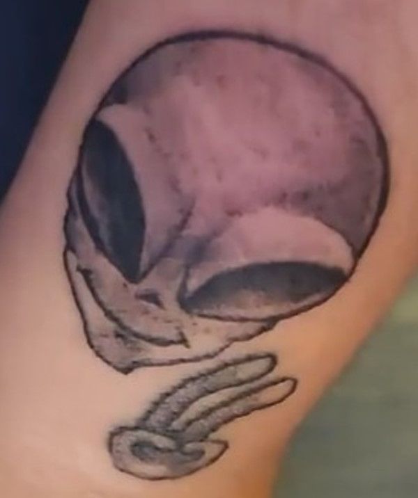 Sridevi Menon's alien face and symbol of peace tattoo