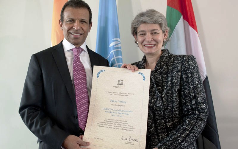 Sunny Varkey holding the certificate that he received after becoming the UNESCO Goodwill Ambassador