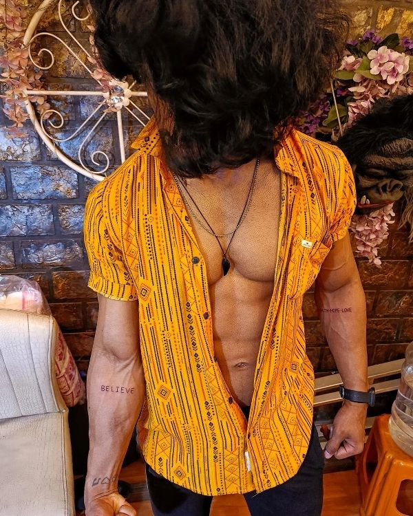 Vishnu Joshi's tattoes on his inner arms