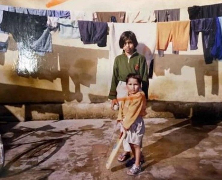 A childhood photo of Dhruv Jurel with his sister (holding bat)