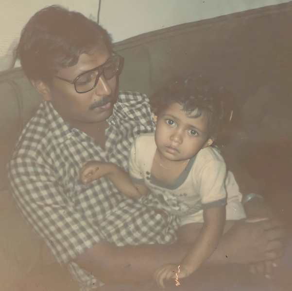 A childhood photograph of Omar Lulu with his father