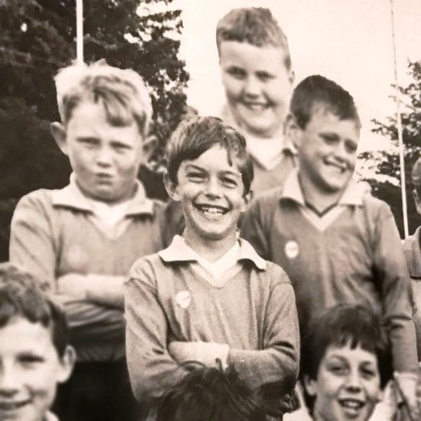 A photo of Finn (standing in the middle) taken after a football match during his school days