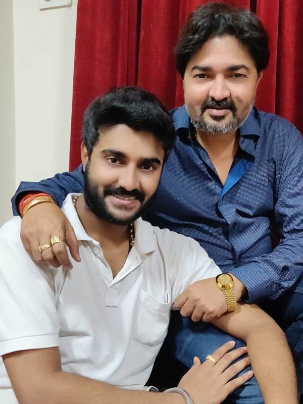 A photo of Pradeep with his father