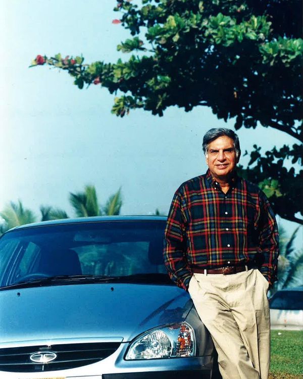 A photo of Ratan Tata standing next to his Tata Indigo Marina