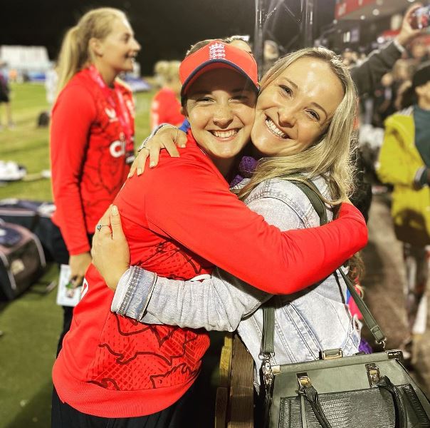 A photograph of Alice Capsey and Libby Capsey after an international match