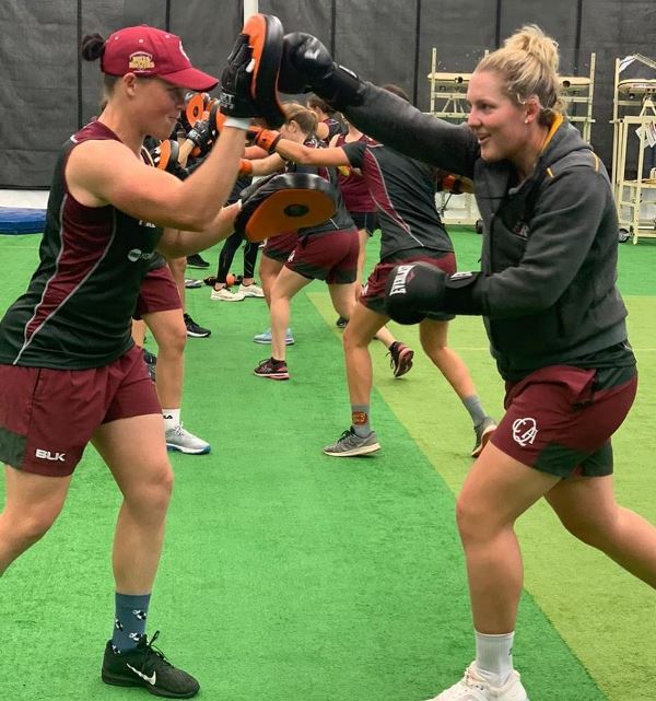 A photograph of Grace Harris and Laura Harris during a training session