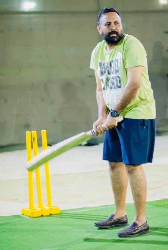 A photograph of Omar Lulu playing cricket