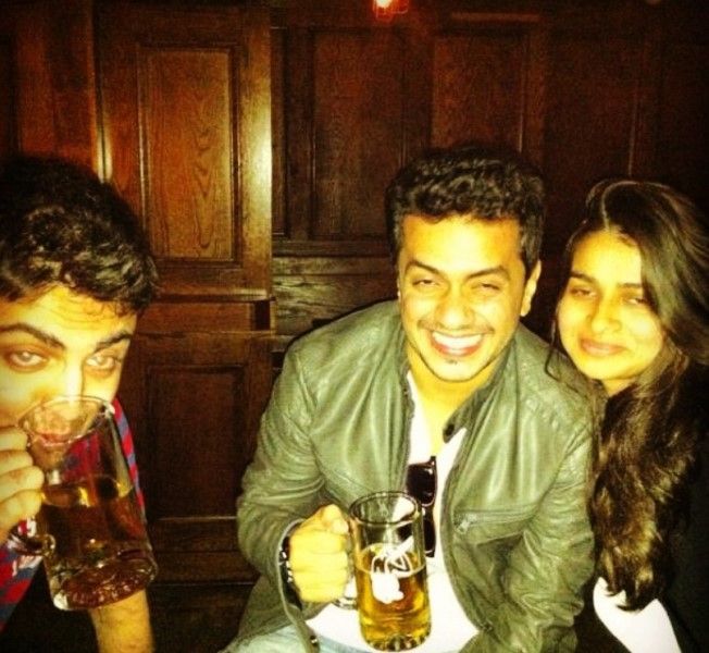 A photograph shared by Charit Desai (centre) on Instagram in which he was seen posing with a glass of beer