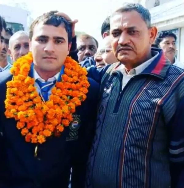 A picture of Manjeet Chhillar with his father