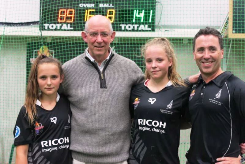 Amelia Kerr (left) and Jess Kerr with their maternal grandfather, Bruce Murray, and father, Robbie Kerr, at the NZ U18 indoor championships