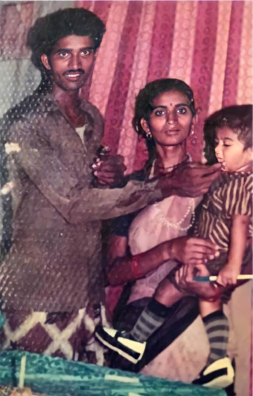 Ananya and her parents celebrating her birthday when she was a child