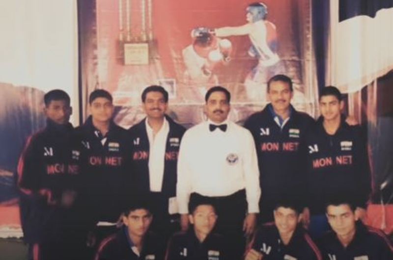 Deepak Boxer with his coach and team