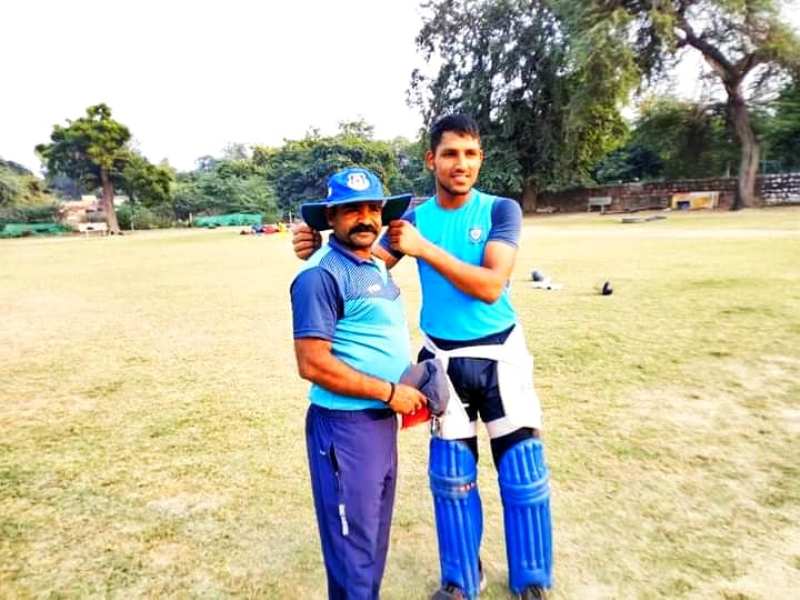 Dhruv Jurel with his coach, Parvendra Yadav