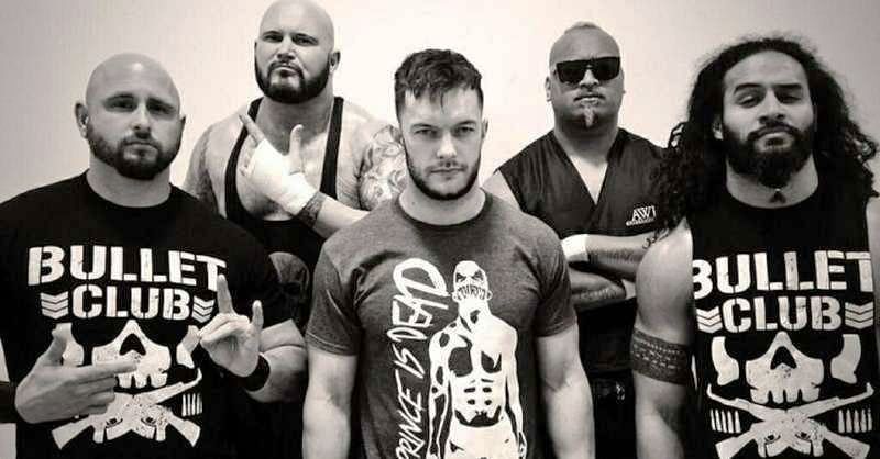 Finn Bálor with the members of the Bullet Club
