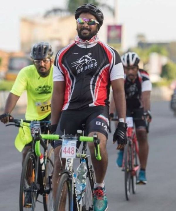 Kalaiyarasan Arjun while riding a bicycle during a duathlon