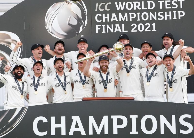 Kane Williamson (holding the trophy) celebrating with New Zealand squad after winning the 2021 World Test Championship