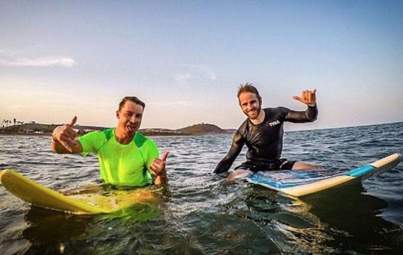 Kane Williamson (right) and Dale Steyn surfing
