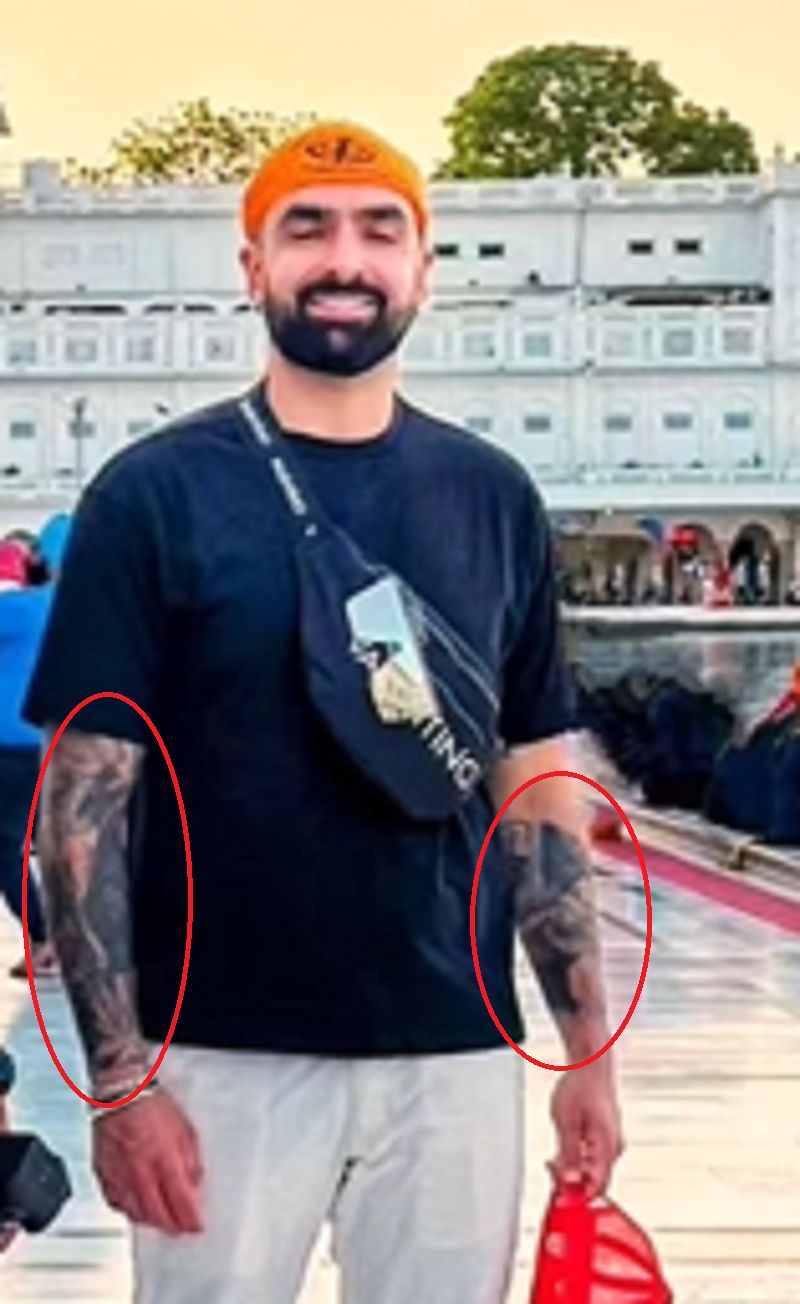 Nathan Karamchandani's tattoo on his left and right hand
