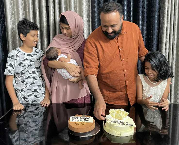 Omar Lulu and his wife celebrating their birthday with the children