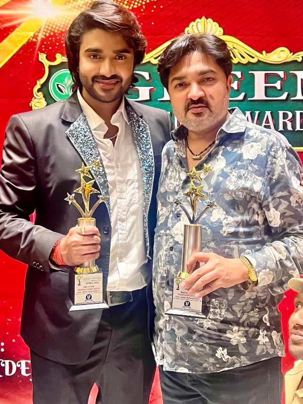 Pradeep with his father holding his Green Cinema Award