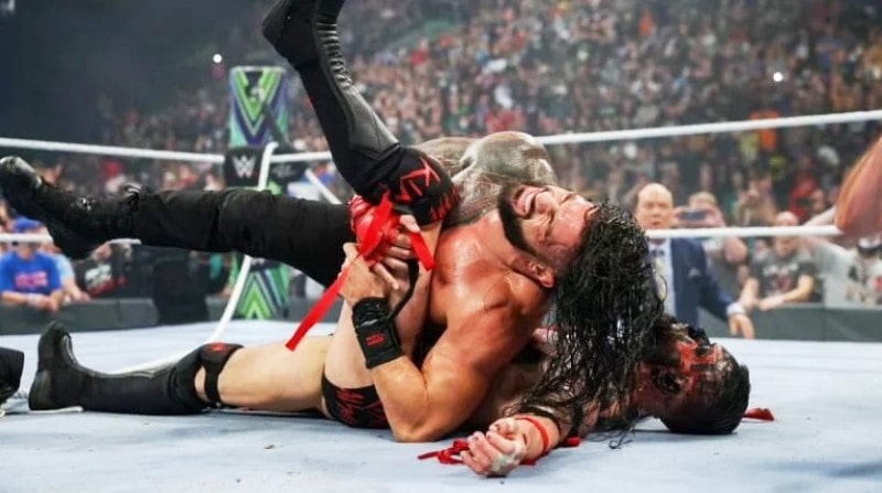 Roman Reigns pinning Finn during a match