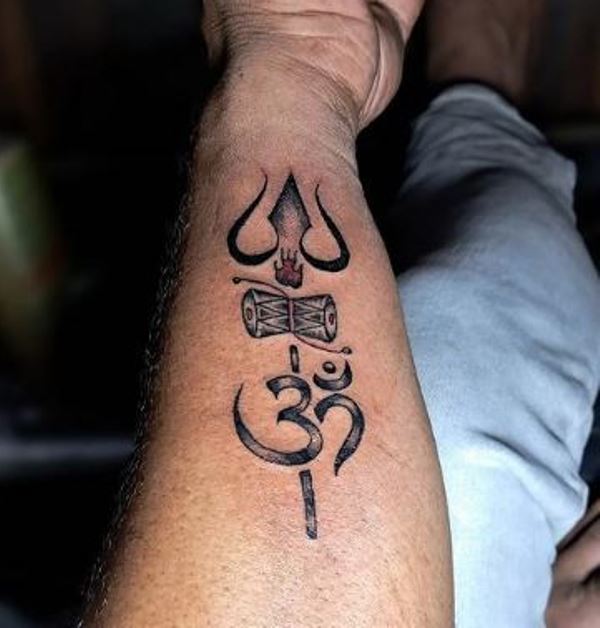 Sampath J Ram's Trishul tattoo on his right forearm