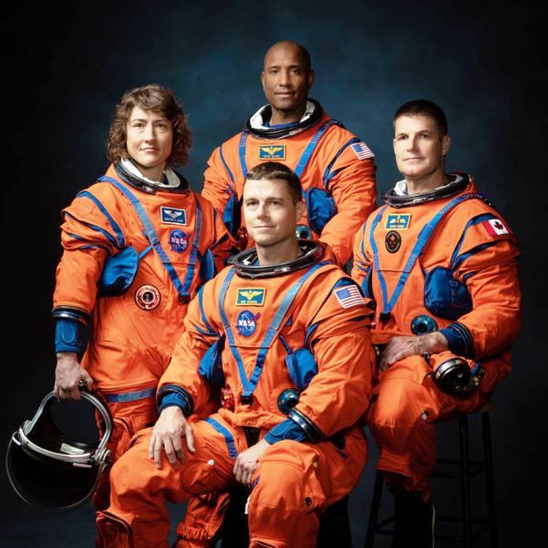The crew of NASA’s Artemis II mission (left to right), NASA astronauts Christina Hammock Koch, Reid Wiseman (seated), Victor Glover, and Canadian Space Agency astronaut Jeremy Hansen