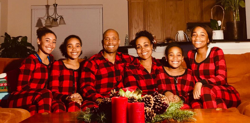 Victor J. Glover with his wife and daughters