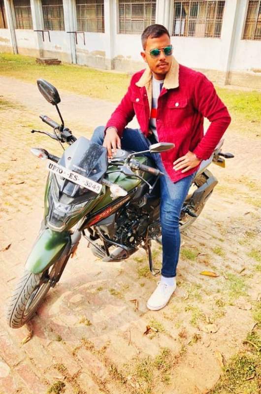 Yash Dayal sitting on his Honda X-Blade bike
