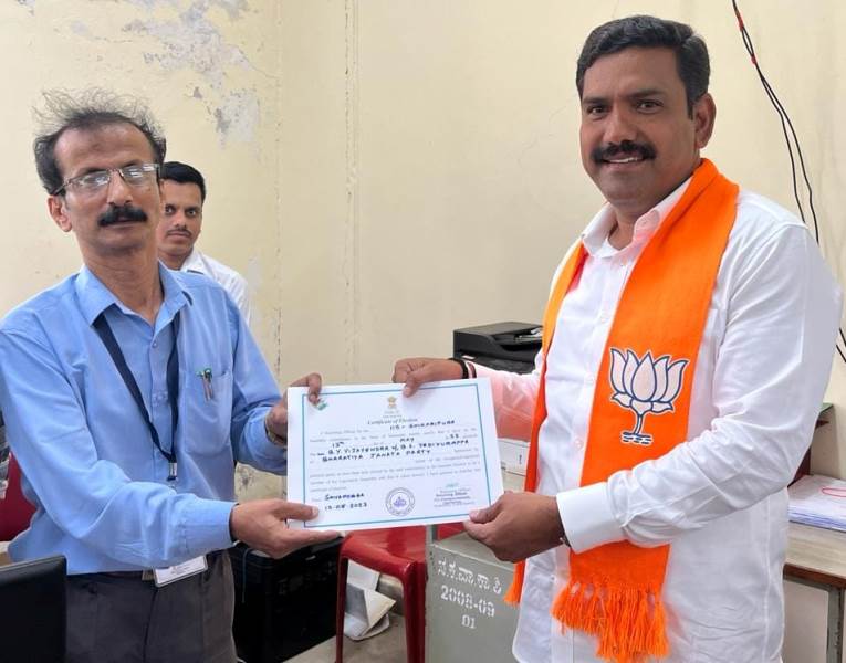 A photograph of B. Y. Vijayendra receiving the certificate from the election officials after being elected as the MLA of the Shikaripura assembly constituency
