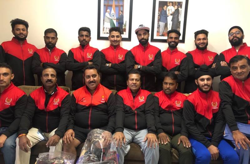 A photograph of Rajkumar Sharma (front row, third from left) with the coaching staff of the Delhi team