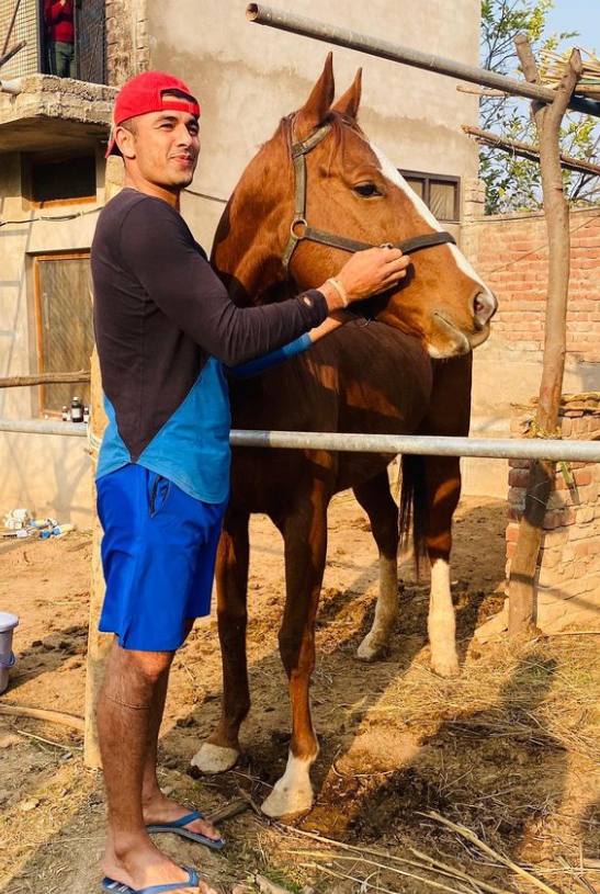 A picture of Ajay Thakur with his horse