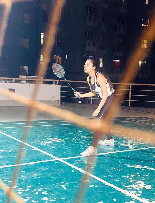 A picture of Adrija Addy Roy while playing badminton